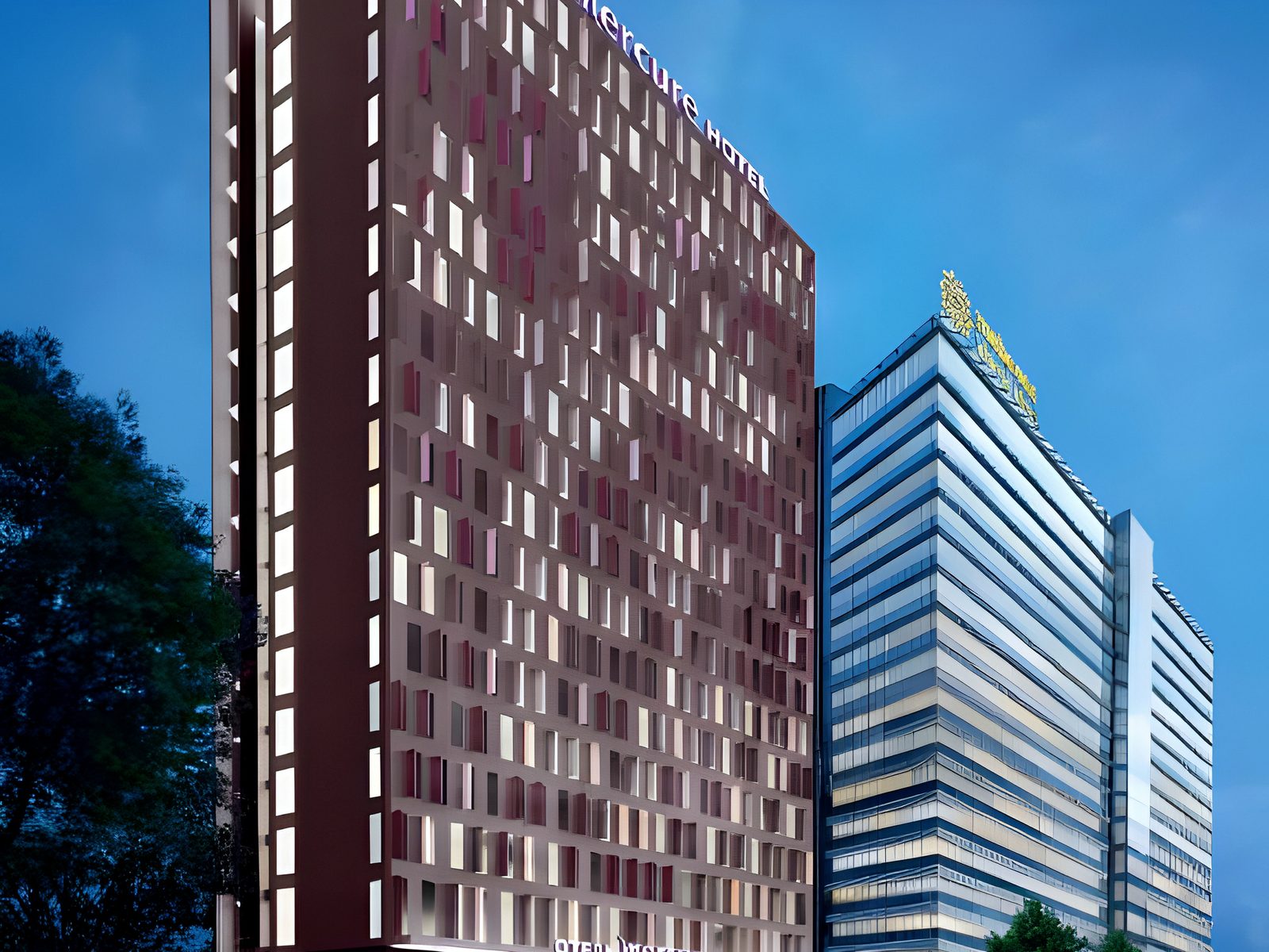Night visualisation of the hotel tower with lit brand signage