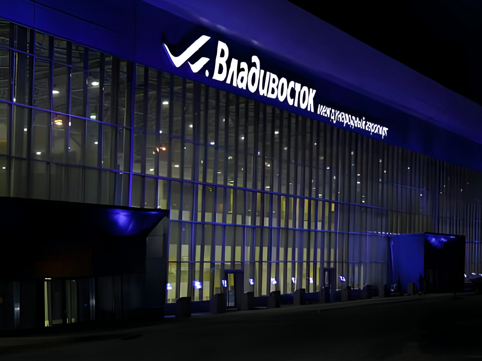 Terminal facade at night with illuminated Vladivostok sign